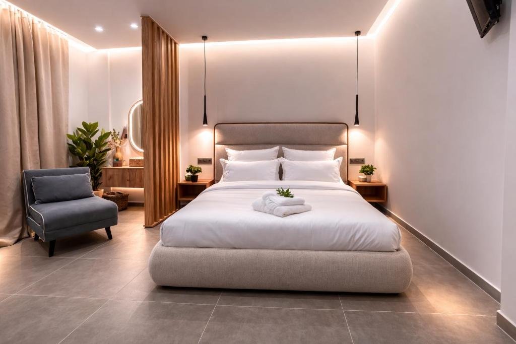 CityZen Luxury Apartments Αγρίνιο — υπνοδωμάτιο με king size κρεβάτι και κρυφό φωτισμό